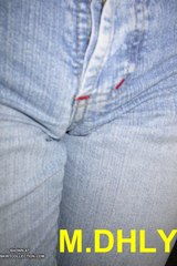 Snug jeans create a lovely camel toe